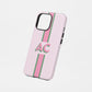 Pink and green striped phone case with bold AC monogram.