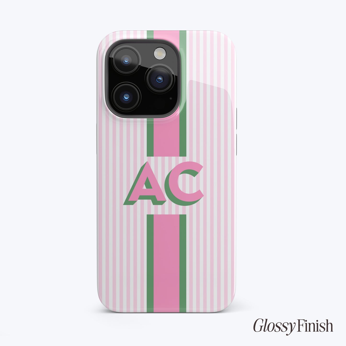 Pink and green striped phone case with large "AC" monogram, glossy finish.