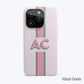 Phone case with pink and green stripes, featuring large green AC initials.
